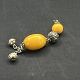 Length 19 cm.Long pendant in silvery metal and two beads in orange bakelite and two bells at ...