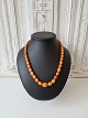 Long Vintage 
necklace with 
polished oval 
amber pearls. 
Length 58 cm. 
The largest 
pearl ...