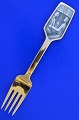 A. Michelsen 
Christmas spoon 
 gilded 
sterling silver 
with enamel 
motif.  
Christmas fork 
from ...
