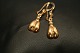Nice earrings in 14 carat gold, with round shapes. The earring is constructed in two parts, so ...