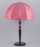 Josef Frank (1885-1967) for Svenskt Tenn, Sweden. Large Art Deco table lamp with a dark pink ...