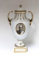 Royal 
Copenhagen. 
Vase. Model # 
2212. Pictures 
of Frederik 
VIII and Queen 
Louise. Height 
34 cm. ...