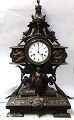 Bronze watch. 
Produced around 
1880. Height 60 
cm. Clockwork 
works