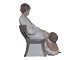 Large Bing & 
Grondahl 
figurine, 
mother in chair 
with child.
The factory 
mark shows, 
that this ...