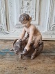 Royal 
Copenhagen 
figure - Faun 
on bear 
No. 648, 
Factory first
Height 16 cm.
Design. Chr. 
Thomsen