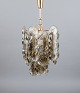 Kalmar, Austria.Ceiling lamp in art glass for six bulbs. Clear and light brown mouth-blown ...