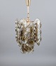 Kalmar, 
Austria.
Ceiling lamp 
in art glass 
for six bulbs. 
Clear and light 
brown 
mouth-blown ...