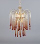 Murano, Italy. 
Ceiling lamp in 
amber 
mouth-blown art 
glass, brass 
frame. Italian 
...