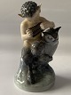 Beautiful little figure depicting Faun with owl. The figure is from Royal Copenhagen, 1st ...