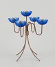 Gunnar Ander 
for Ystad 
Metall, Sweden. 
Tall 
candlestick 
holder in brass 
and blue art 
glass ...