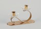 Gunnar Ander 
for Ystad 
Metall, Sweden. 
Candlestick 
holder in brass 
and clear art 
glass shaped 
...