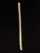 14 carat gold 
bracelet 18.5 
cm. B.0.65 cm. 
from goldsmith 
Chr. Veilskov 
Copenhagen 
subject no. ...