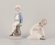 Lladro, Spain. 
Two porcelain 
figurines. Boy 
in sailor 
outfit with a 
model ship in 
hand and a ...