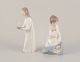 Lladro, Spain. Two porcelain figurines. Girl with a nightstand lamp and an angel figurine with a ...