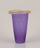 Ulrica Hydman 
Vallien 
(1938-2018) for 
Kosta Boda. 
Vase in violet 
and yellow art 
glass.
Late ...