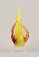Swedish glass 
artist. Large 
sculpture in 
art glass.
Yellow and 
amber 
decoration on a 
square ...