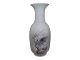Royal 
Copenhagen 
angular vase 
decorated with 
cherry blossoms 
and butterfly.
The factory 
mark ...