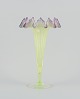 Trelleborgs Glasbruk, Sweden. Trumpet-shaped art glass vase in light green and 
violet glass. Mouth-blown.