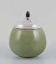 Royal 
Copenhagen 
ceramic jar. 
Silver lid with 
an ebony knob.
Celadon glaze.
Model ...