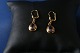 These gold 
earrings in 14 
carat gold, 
with inlaid 
amethyst are 
high class, and 
are elegant for 
...