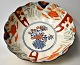 Imari bowl in 
porcelain, 19th 
century Japan. 
Polychrome 
decorated. 
Ruffled edge. 
Unstamped. H.: 
...