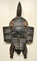 African mask, mid 20th century. Carved wood. H.: 34 cm.Provenance: Globetrotter, journalist ...