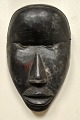 African mask, mid 20th century. Carved hardwood. H.: 21 cm.Provenance: Globetrotter, ...