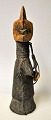 African wooden 
figure, 
mid-20th 
century. A 
woman. Wooden 
figure covered 
with leather. 
On the ...