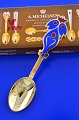 A. Michelsen 
Christmas 
cutlery, gilded 
sterlingsilver 
with an inlaid 
enamel motif.  
Christmas ...