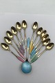 Frigast 
Sterling 
Silver/Enamel 
Spoons (12+1)
Measures 11 cm 
and 9.5 cm 
(4.33 inch and 
3.74 inch)