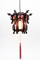 Made of wood 
with intricate 
carvings, this 
pendant lamp 
reflects the 
rich artistic 
heritage of ...