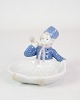Porcelain figure with a motif of a seated boy in uniform, which can be used as a small bowl no. ...