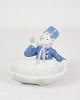 Porcelain 
figure with a 
motif of a 
seated boy in 
uniform, which 
can be used as 
a small bowl 
no. ...