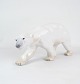 The porcelain figure of a walking polar bear with number 1785 from Bing & Grøndahl (Gl. B&G) is ...