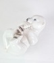The Bing & Grøndahl porcelain figurine of a polar bear cub lying on its back with number 2538 is ...