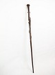Cane in 
rosewood with a 
carved motif of 
a man being 
bitten by a 
snake from 
around the 
1960s. ...
