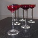 Six shot glasses, five red and one white, on a tall stem, sold together All in good condition. ...
