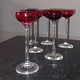 Six shot 
glasses, five 
red and one 
white, on a 
tall stem, sold 
together All in 
good condition. 
...