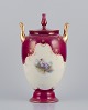 Rosenthal and 
Wien. Early 
lidded 
porcelain vase 
with two 
handles.
Classic form. 
Hand-painted at 
...