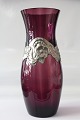 Beautiful 
antique vase in 
aubergine-
coloured glass, 
with pewter 
frame. The vase 
is 27 ...