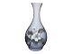 Royal 
Copenhagen vase 
with white 
flowers.
Please note 
that this item 
is exclusively 
available ...