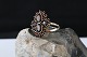Beautiful and very elegant lady's ring with red garnets. The ring is made with attention to ...