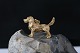 Pendant in 14 carat gold, designed as a cute dog. Stamped 585