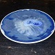 Porcelain plate covered in blue crystal glaze on the front. Made at the Rosenthal Porcelain ...