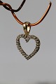 Beautiful and 
exclusive 
pendant in 14 
carat gold, 
perfect for a 
thin gold 
chain. The 
pendant has ...