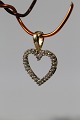 Beautiful and 
exclusive 
pendant in 14 
carat gold, 
perfect for a 
thin gold 
chain. The 
pendant has ...