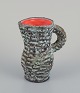 Vallauris, France. Small ceramic pitcher. 
Raku fired glaze with an orange interior.