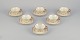 A set of six 
KP, Karlskrona 
(Sweden) tea 
cups with 
saucers in 
cream-colored 
porcelain with 
gold ...