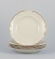 KPM, Poland. A set of five large deep porcelain plates in cream color.
Gold-rim decoration.