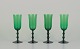Simon Gate for Orrefors, Sverige. Fire ”Salut” champagneglas i grønt mundblæst 
kunstglas.